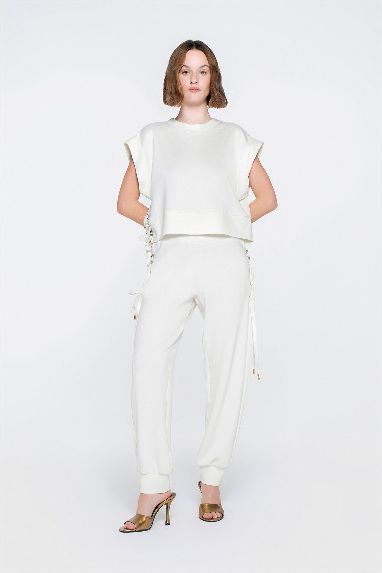 GIZIA SPORT - Sleeveless Ecru Blouse With Gold Silvery Buttonhole And Cord Detail On The Side