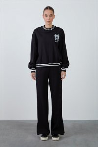 KIWE - Black Tracksuit with Pants Featuring Slits for Comfortable Fit